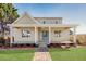Charming home with a welcoming front porch, lush lawn, and beautiful brick walkway at 3286 Bachelor Street, East Point, GA 30344