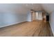 Bright bonus room featuring laminate wood floors, light blue walls, and recessed ceiling lights at 5176 Ashbury Manor Ln, Sugar Hill, GA 30518