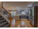 Modern kitchen featuring stainless steel appliances, hardwood floors, and a stylish island with seating at 5176 Ashbury Manor Ln, Sugar Hill, GA 30518