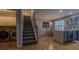 Open kitchen layout with hardwood floors, stainless steel appliances, and convenient access to laundry area at 5176 Ashbury Manor Ln, Sugar Hill, GA 30518