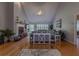 Spacious living room with hardwood floors, fireplace, and abundant natural light, creating a warm and inviting space at 5176 Ashbury Manor Ln, Sugar Hill, GA 30518