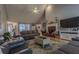 Inviting living room with vaulted ceiling, a fireplace, and comfortable seating arrangement at 5176 Ashbury Manor Ln, Sugar Hill, GA 30518