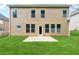 Home exterior features a flat, grassy backyard and patio perfect for entertaining at 5430 Breckinridge Ln, Cumming, GA 30040