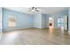 Spacious bedroom with large window and hardwood floors at 5430 Breckinridge Ln, Cumming, GA 30040