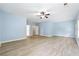 Large bedroom with ceiling fan and hardwood floors at 5430 Breckinridge Ln, Cumming, GA 30040