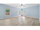 Large bedroom with lots of windows and hardwood floors at 5430 Breckinridge Ln, Cumming, GA 30040