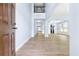 Bright foyer with hardwood floors, high ceilings, and views into the living spaces at 5430 Breckinridge Ln, Cumming, GA 30040
