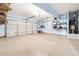 Spacious garage with ample storage shelving and room for multiple vehicles at 5430 Breckinridge Ln, Cumming, GA 30040