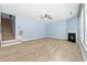 Large living room featuring hardwood floors, a fireplace, and a staircase at 5430 Breckinridge Ln, Cumming, GA 30040