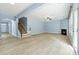 Open living room with hardwood floors, a fireplace, and access to the outdoors at 5430 Breckinridge Ln, Cumming, GA 30040