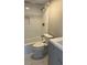 Bathroom featuring a shower-tub combo with new tilework and modern fixtures at 188 Rue Fontaine, Lithonia, GA 30038