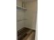Walk-in closet with shelf and clothes-hanging bar at 188 Rue Fontaine, Lithonia, GA 30038