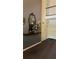 Hallway leading to a loft with decoratively appointed mirror and table at 188 Rue Fontaine, Lithonia, GA 30038