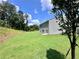 Large backyard with lawn, surrounding woods, and sunny sky is perfect for Gathering and fun at 34 Sonoma Drive, Dallas, GA 30157