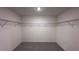 Large walk-in closet with wire shelving and carpet flooring offers great storage space at 34 Sonoma Drive, Dallas, GA 30157