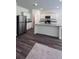 Modern kitchen with stainless steel appliances, granite countertops, and a kitchen island at 34 Sonoma Drive, Dallas, GA 30157