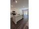 Bright kitchen with a center island, stainless steel appliances, and hardwood flooring at 34 Sonoma Drive, Dallas, GA 30157