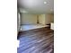 Bright living space with hardwood flooring and a view into the kitchen area at 34 Sonoma Drive, Dallas, GA 30157