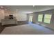 Bright living space with an open layout with a kitchen, dining and carpeted living area at 34 Sonoma Drive, Dallas, GA 30157