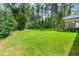 Vast backyard provides a serene outdoor retreat, surrounded by lush greenery for privacy and tranquility at 5015 Monticello Dr, Villa Rica, GA 30180