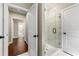 Bathroom with decorative glass shower, and white doors and trim at 5015 Monticello Dr, Villa Rica, GA 30180