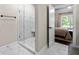 Bathroom featuring frameless glass shower with marble tile at 5015 Monticello Dr, Villa Rica, GA 30180