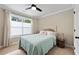 Bright bedroom featuring a comfortable bed, neutral walls, and a window with natural light, creating a cozy atmosphere at 5015 Monticello Dr, Villa Rica, GA 30180
