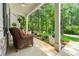 Cozy covered porch featuring comfortable seating and lush greenery, perfect for relaxation at 5015 Monticello Dr, Villa Rica, GA 30180