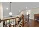 A view from the upper level, showcasing the staircase and the spacious living room below, filled with natural light at 5015 Monticello Dr, Villa Rica, GA 30180