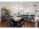 Bright kitchen with white cabinets, stainless steel appliances, and dark wood floors at 5015 Monticello Dr, Villa Rica, GA 30180