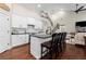 Kitchen with island seating, stainless appliances, and a view into the living room at 5015 Monticello Dr, Villa Rica, GA 30180