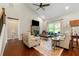 Relaxing living room with a stone fireplace, hardwood floors, and two comfortable chairs near a window at 5015 Monticello Dr, Villa Rica, GA 30180