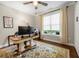 Cozy home office with natural light, hardwood floors, and ample workspace at 5015 Monticello Dr, Villa Rica, GA 30180
