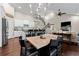Open concept floor plan featuring a kitchen, dining area, and living room with beautiful hardwood floors and modern fixtures at 5015 Monticello Dr, Villa Rica, GA 30180