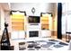Elegant living room with fireplace, built-in shelving, and tall windows at 555 Stoneglen Sw, Atlanta, GA 30331