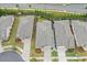 Aerial view of neighborhood homes displaying manicured lawns and private fenced yards at 205 Floral Valley Dr, Woodstock, GA 30188