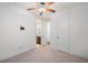 Bright bedroom with ceiling fan and carpeted floors, adjoined by an ensuite bathroom for added convenience at 205 Floral Valley Dr, Woodstock, GA 30188