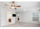 Bright bedroom with ceiling fan, TV, ensuite bathroom access, and large windows, creating a comfortable retreat at 205 Floral Valley Dr, Woodstock, GA 30188