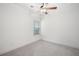 Bedroom featuring carpet flooring, a ceiling fan, natural lighting, and bare walls for decorating at 205 Floral Valley Dr, Woodstock, GA 30188