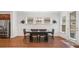 Formal dining room featuring modern table set with natural light coming through the windows at 205 Floral Valley Dr, Woodstock, GA 30188