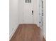 Inviting entryway with hardwood floors and a bright white front door, creating a warm welcome at 205 Floral Valley Dr, Woodstock, GA 30188