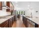 Open-concept kitchen view with stainless steel appliances and island overlooking the dining area at 205 Floral Valley Dr, Woodstock, GA 30188