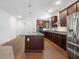 Bright kitchen boasts stainless steel appliances, a center island, and hardwood floors at 205 Floral Valley Dr, Woodstock, GA 30188