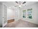 Office space featuring french doors with carpeted flooring and natural lighting at 205 Floral Valley Dr, Woodstock, GA 30188