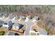 Aerial view of cul-de-sac home with a two car garage in a well-kept neighborhood and mature trees at 2536 Dayview Ln, Atlanta, GA 30331