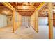 Unfinished basement featuring ceiling insulation, exposed framing, and a concrete floor at 2536 Dayview Ln, Atlanta, GA 30331