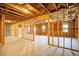 This home features an unfinished basement with exposed framing, windows and concrete flooring at 2536 Dayview Ln, Atlanta, GA 30331