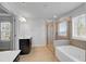 Spacious bathroom featuring a glass-enclosed shower and a soaking tub at 2536 Dayview Ln, Atlanta, GA 30331