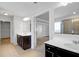 Bright bathroom with dual vanities, stylish dark wood cabinets, and neutral tiling at 2536 Dayview Ln, Atlanta, GA 30331