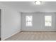 This bedroom features neutral walls and carpet, along with two sunlit windows at 2536 Dayview Ln, Atlanta, GA 30331